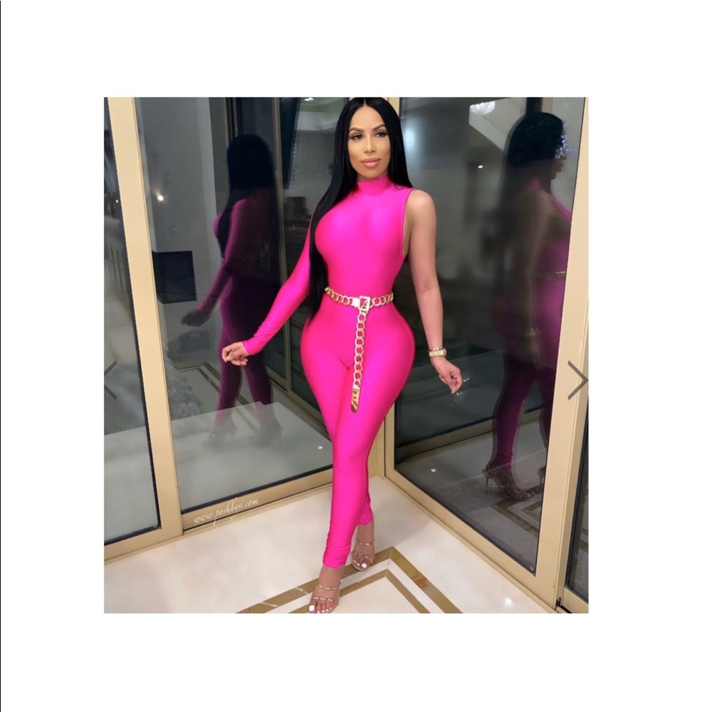 Pink jumpsuit with gold chain belt